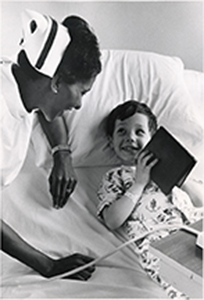 Photograph of a Student Nurse with a Young Patient