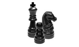 three black chess pieces